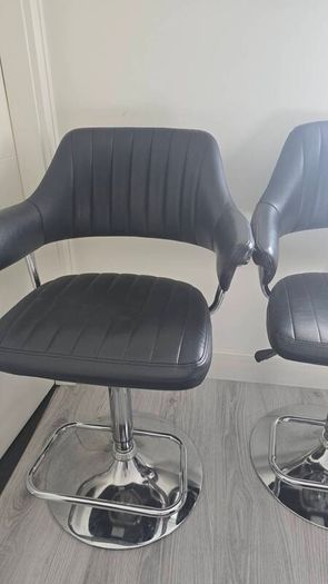 Adjustable black faux leather swivel bar stool with a metal base x3