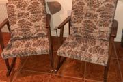 pair of vintage rocking arm chairs