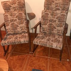 pair of vintage rocking arm chairs