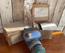 2 vintage gas masks with boxes. Air Raid Precautions..