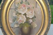 Oval oil painting depicting a still life with flowers,