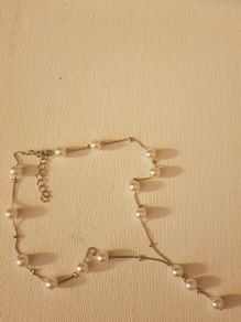 Pearl design necklace, bracelet and earrings