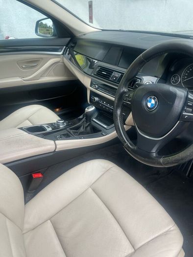 BMW 5 series, black with cream leather interior