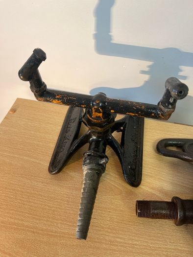 Two vintage rain king cast iron sprinklers