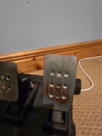 Thrustmaster T248 Racing Wheel and T3PM Pedal Set, complete with a sturdy folding metal wheel stand.