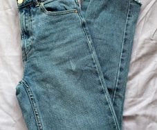 Distressed blue jeans
