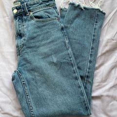 Distressed blue jeans