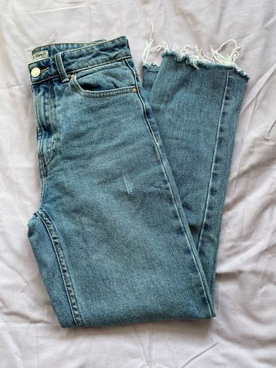 Distressed blue jeans
