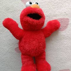 Laughing Elmo muppet sesame Street.