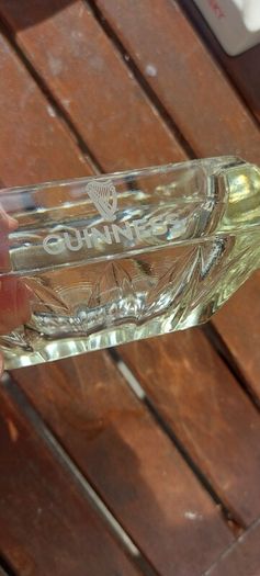 Guinness vintage heavy pressed glass ashtray,,,collectors item, unusual with clear glass ,guinness logo on the 4 sides ,,see pictures for condition, sold as seen ,