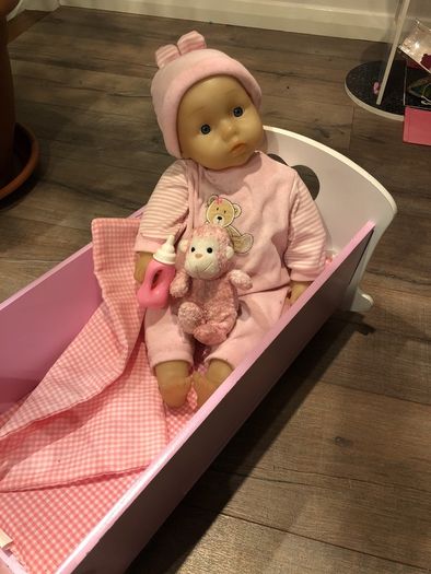 Doll crib with a baby