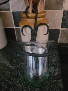 2 wall mounted wrought iron candle holders