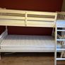 White wooden bunk beds with mattresses Image 3