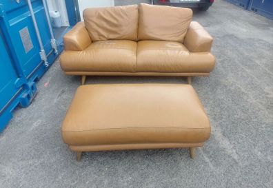 Brown leather couch and matching foot stool