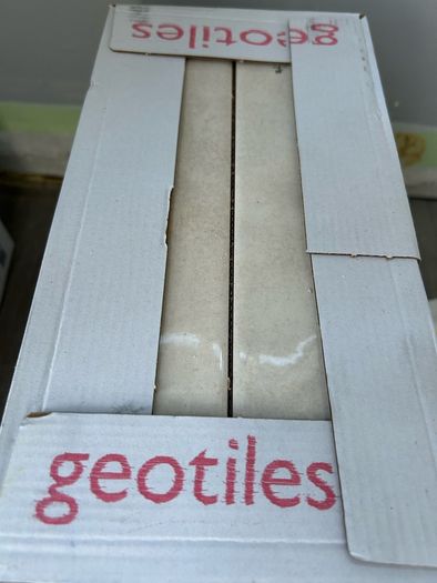3 boxes tiles and adhesive