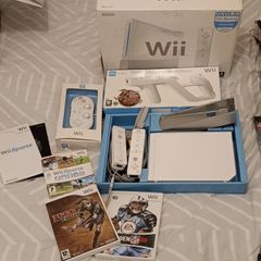 Nintendo Wii. Wireless controllers x2. Wii Classic Controller. Wii Zapper. Games X3.