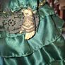 Vintage Large Victorian-style collectible Porcelain Doll featuring curly reddish-brown hair and a multi-layered emerald green satin and lace dress Image 5