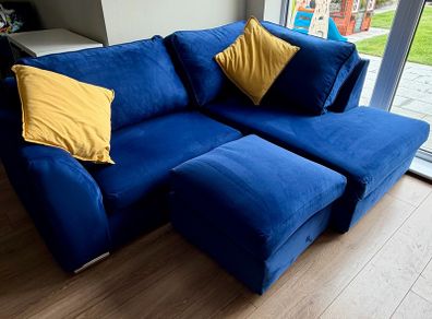 Corner sofa with footstool