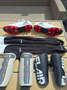 Addidas football boots, shin guards and socks.