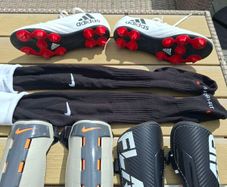 Addidas football boots, shin guards and socks.