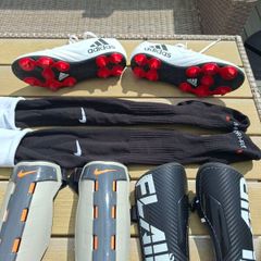 Addidas football boots, shin guards and socks.