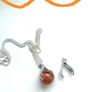 Silver tone necklace with unique hand-clasp pendant Image 4