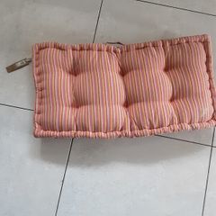 Large padded outdoor cushion with handle