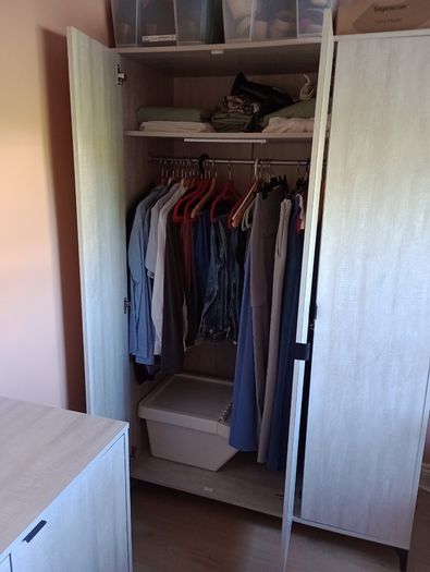 Three-door wardrobe in light wood effect finish