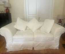 2 cream sofas