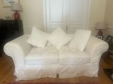 2 cream sofas
