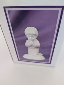 Praying girl figurine