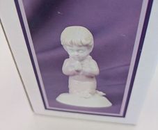 Praying girl figurine