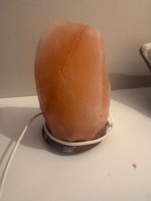 Himalayan salt lamp with wooden base