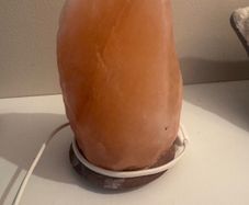 Himalayan salt lamp with wooden base