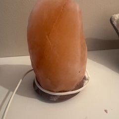 Himalayan salt lamp with wooden base