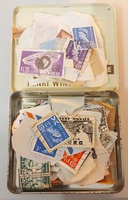Tin of vintage stamps