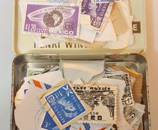 Tin of vintage stamps