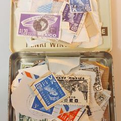 Tin of vintage stamps