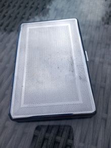 Silver tone case, stamped M to E, D18 post 7e