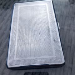 Silver tone case, stamped M to E, D18 post 7e