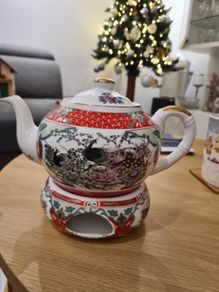 Fine porcelain tea pot with tea light warmer
