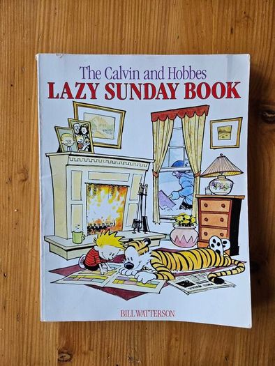 The Calvin And Hobbs X 2 Books. I X Lazy Sunday Book. 2 X There's Treasure Everywhere.  Both By Bill Watterson. Large Volume Paperback In Good Condition.  See Photos For Same