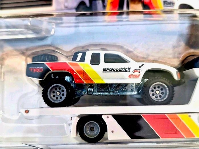 Hotwheels Toyota Off Road Truck with Fleet Street transporter.