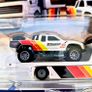 Hotwheels Toyota Off Road Truck with Fleet Street transporter. Image 2