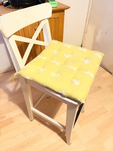 White wooden cross-back bar stool