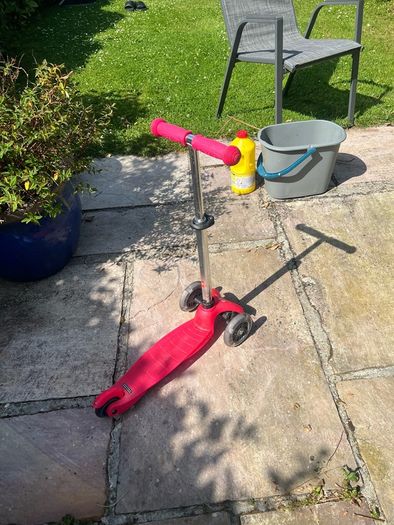 Young child's light up wheel scooter.