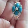 A 925 sterling silver ring with turquoise, opal, and topaz. Image 2