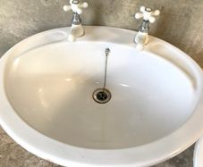 White Ceramic Over Counter Basin with White Taps