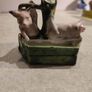 figurine of two pigs cooling down at bone china  water pump. Image 4