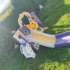 Toddlers slide and swing